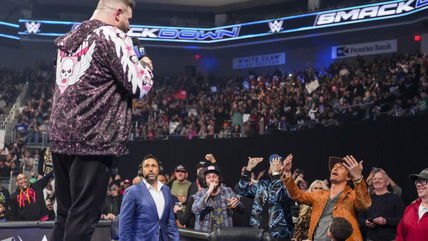 WWE legend poses with Matthew McConaughey backstage after the actor endures brutal Texas Longhorns dig on SmackDown