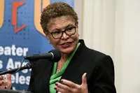 Karen Bass admits she felt ‘terrible not being here for my city’ amid fires