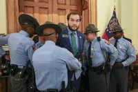 Georgia state senator arrested after being barred from Kemp address