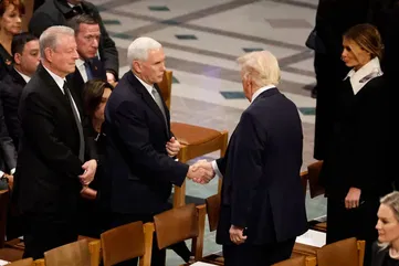 Trump shakes hands with Pence, chats with Obama at Carter funeral