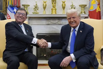 Trump strikes deals with Japanese prime minister as he turns the screw on China