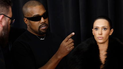 Kanye West makes surprise Grammys return as wife arrives nearly nude on the red carpet